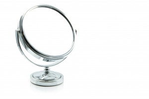 silver makeup mirror isolated on white.