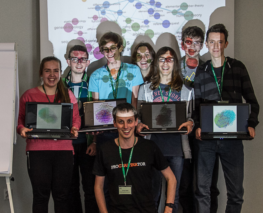 After “complex networks are simple” workshop on the multidisciplinary camp in 2015. Participants hold their graph visualization of Facebook networks, in Gephi.